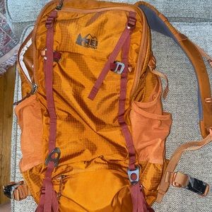 Orange REI Trail 25 backpack